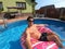 Happy man relax on inflatable ring. Holiday 2020