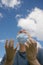 Happy man removing his face mask as Covoid-19 restrictions are lifted,England,United Kingdom