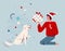 Happy man in santa hat gives a present for Christmas to his dog. Raising and training a puppy. Pet party