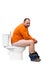 Happy man sitting on toilet