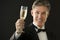 Happy Man In Tuxedo Holding Champagne Flute