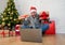 Happy man on video call celebrating virtual christmas with family online at home in lockdown