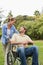 Happy man in wheelchair talking with partner