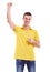 Happy man in a yellow polo shirt with hand up