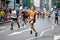 Happy Marathon runner cheering by public. Charity money raise.. London, UK