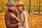Happy maried couple spend romantic time in autumn park