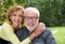 Happy married couple smiling together outdoors