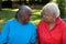 Happy mature African American sisters laughing and smiling.