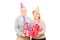 Happy mature couple with birthday hats holding presents