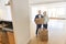 Happy Mature Couple With Cardboard Boxes At New Home