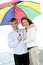 Happy mature couple with umbrella