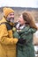 happy mature family on winter vacation. away in wild. Smiling middle aged man and woman in snowy nature or park together