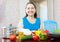Happy mature housewife with vegetables