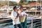 Happy Mature Spouses Embracing At Marina Backdrop With Luxury Yachts