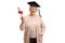 Happy mature woman with a graduation hat holding a diploma