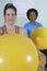 Happy Mature Woman Holding Exercise Ball