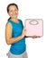 Happy mature woman holding scale