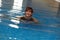 Happy mature woman in swimming pool
