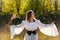 Happy medieval young woman in historical female costume at nature. Fantasy girl in long dress or gown