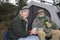 Happy Men Having Coffee On A Camping Trip