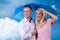 Happy middle age couple looking into the future unter an umbrella