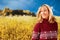 Happy middle age woman in front of a flower field