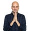Happy middle aged bald man praying