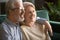 Happy middle-aged family, wife and husband embracing at home