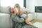 Happy military officer hugging his cute daughter tight