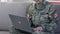 Happy military woman talking to family laptop by online application, technology