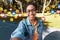 Happy millennial afro american lady in casual, glasses makes selfie in park for social networks and blog