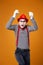 Happy mime man in vest and red hat Isolated on orange background