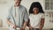 Happy Mixed Couple Cooking Together Standing In Modern Kitchen Indoors