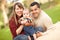 Happy Mixed Race Family Posing for A Portrait