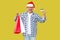 Happy modern casual style middle aged man in red new year cap, e