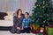happy mom and son at home celebrate Christmas, New year mood, Christmas tree and gifts