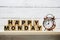 Happy Monday wooden letter alphabet with alarm clock item on wooden background