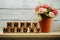 Happy Monday wooden letter alphabet with roses flower item on wooden background