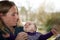 Happy mother admiring baby girl