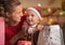 Happy mother and baby checking christmas shopping bags