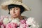 Happy mother with big bouquet of pink peonies giving from children. Happy Mothers day concept. Beautiful elder woman in hat posing