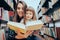 Happy Mother and Child Checking a Book at the Library