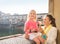 Happy mother and child eating ice cream near Ponte Vecchio