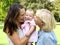 Happy mother with child and grandmother outdoors