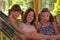 Happy mother and children having fun in hammock