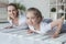 happy mother and daughter doing push ups together on yoga mats