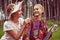 Happy mother with a daughter and a guitar. Musical family. Mom with her teenage daughter have fun outdoors