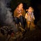 Happy mother and daughter tourists eating grilled sausages