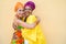Happy mother and daughter with traditional african dresses smiling on camera - Family lifestyle and ethnic concept - Focus on