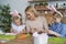 Happy mother and daughters preparing Easter decorations at home